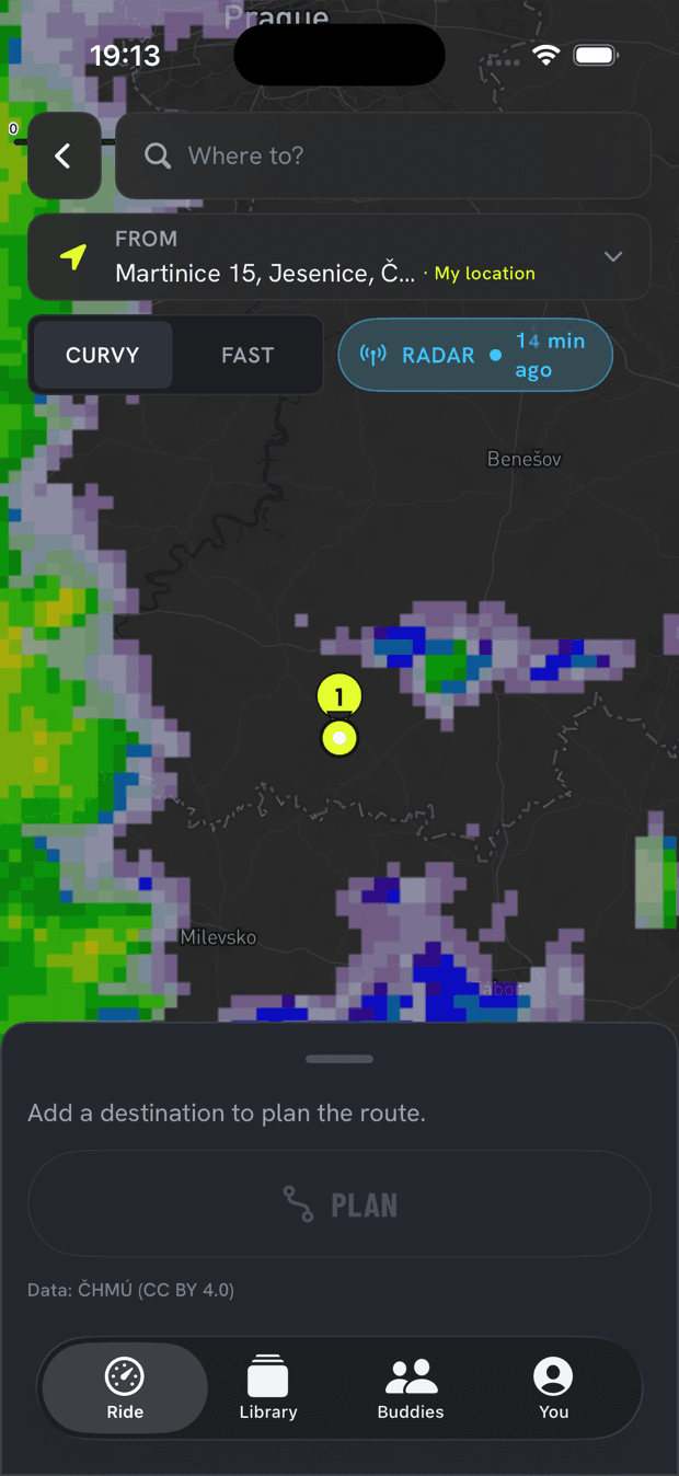 motobud's map-first route planner — live ČHMÚ rain radar filling the map behind compact controls, precipitation cells over Prague and Benešov